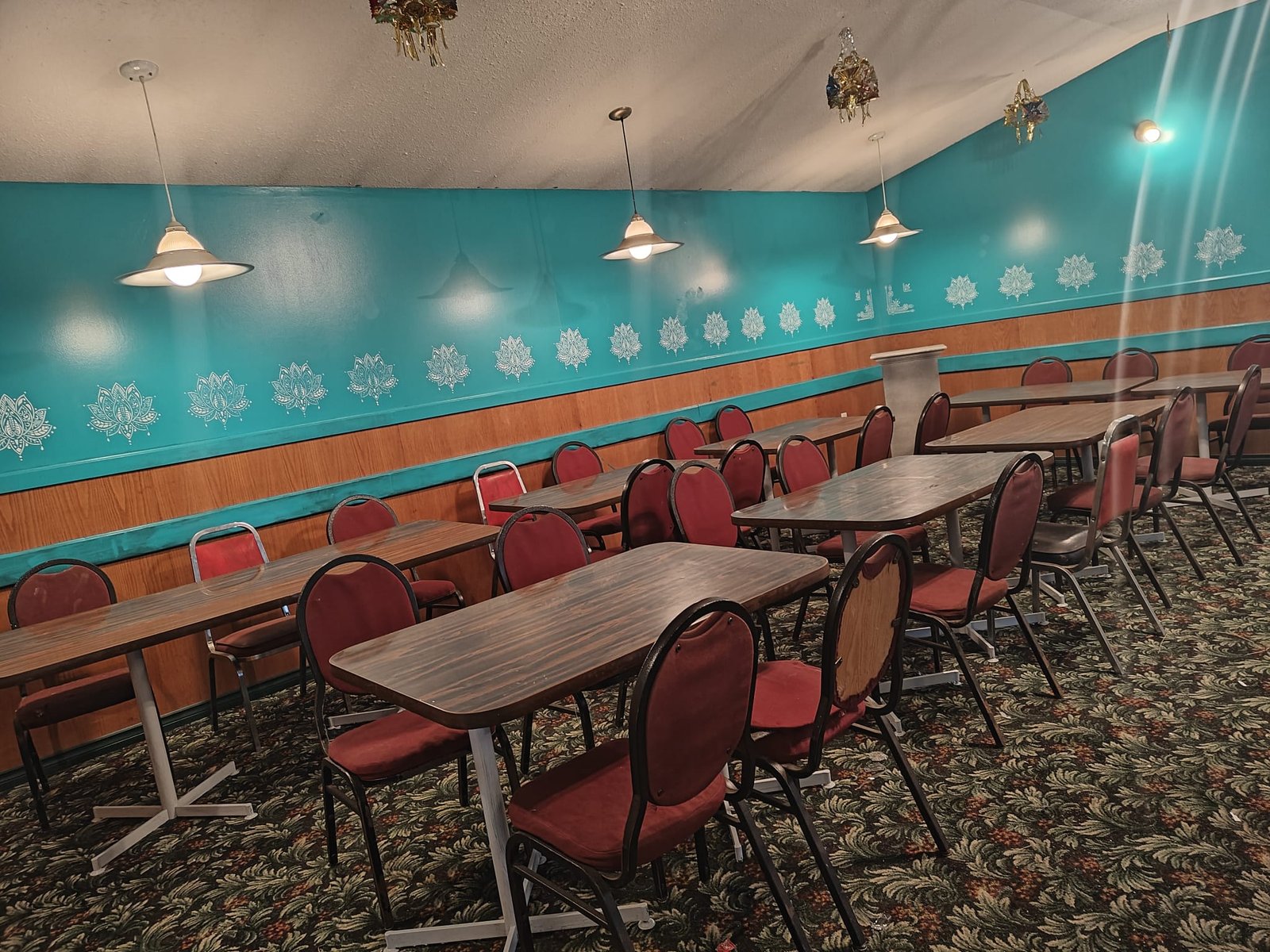 Platania Tavern dining room with tables and red chairs